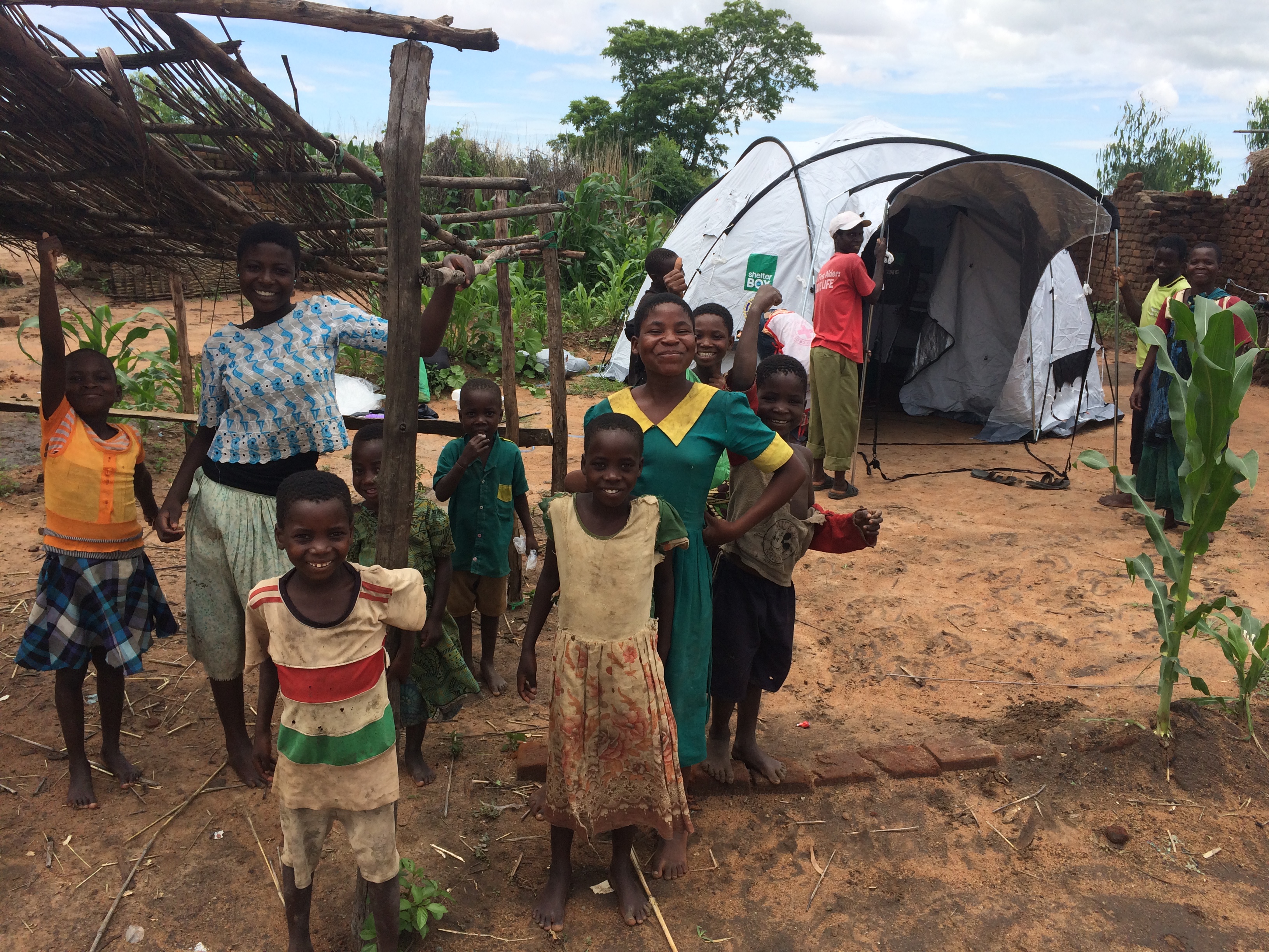 ShelterBox standard releif tent in the background.